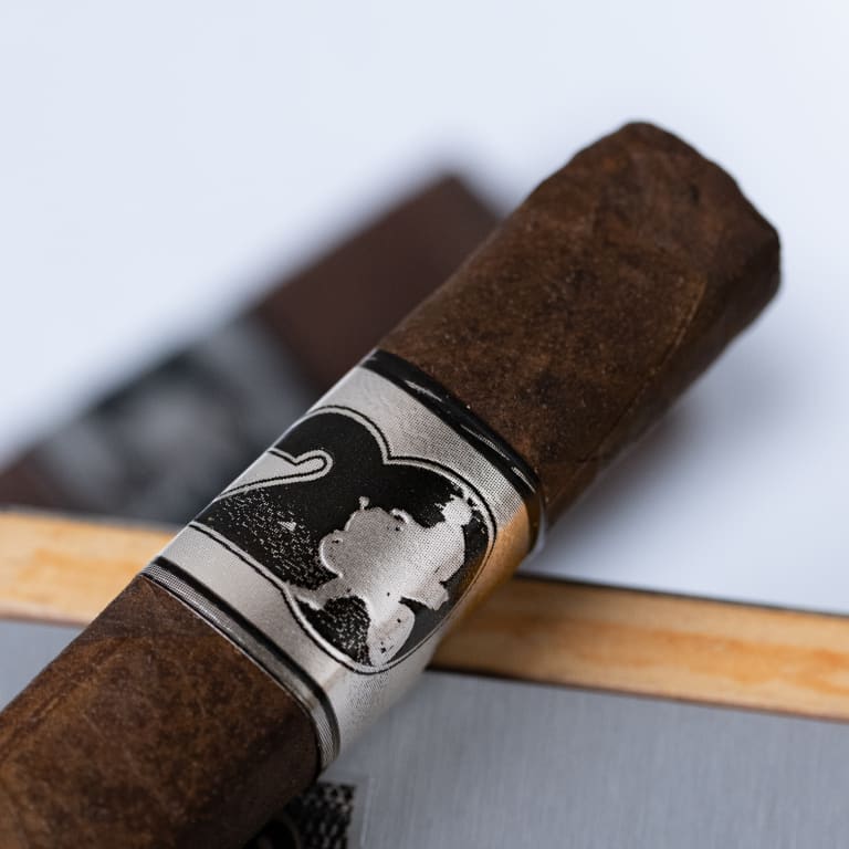 acid 20 cigaron on a white surface