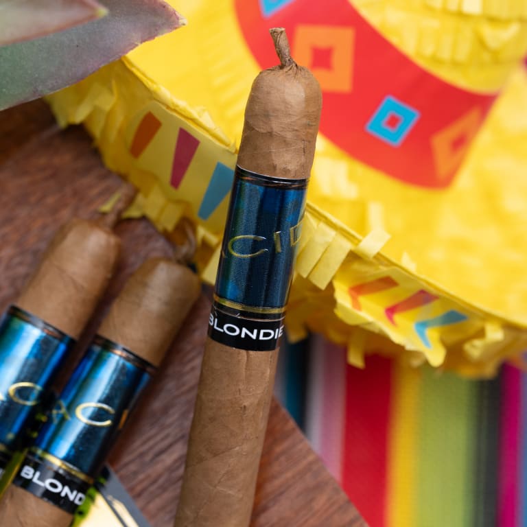 acid blue cigar on a colorful surface