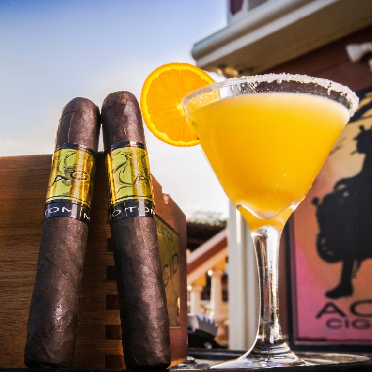 acid gold cigar in front of a blurred background