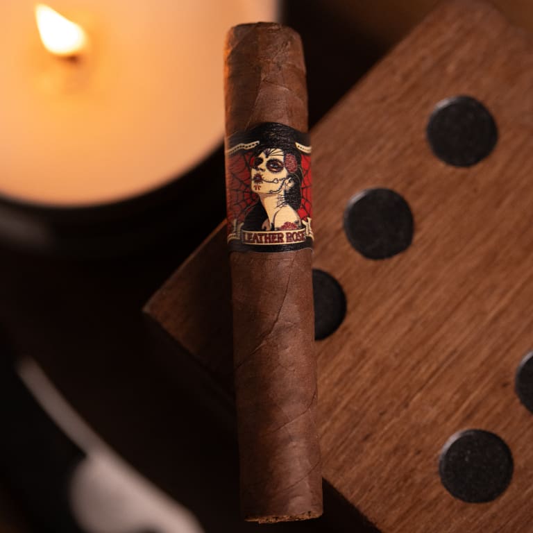 deadwood leather rose cigar resting on a wooden block