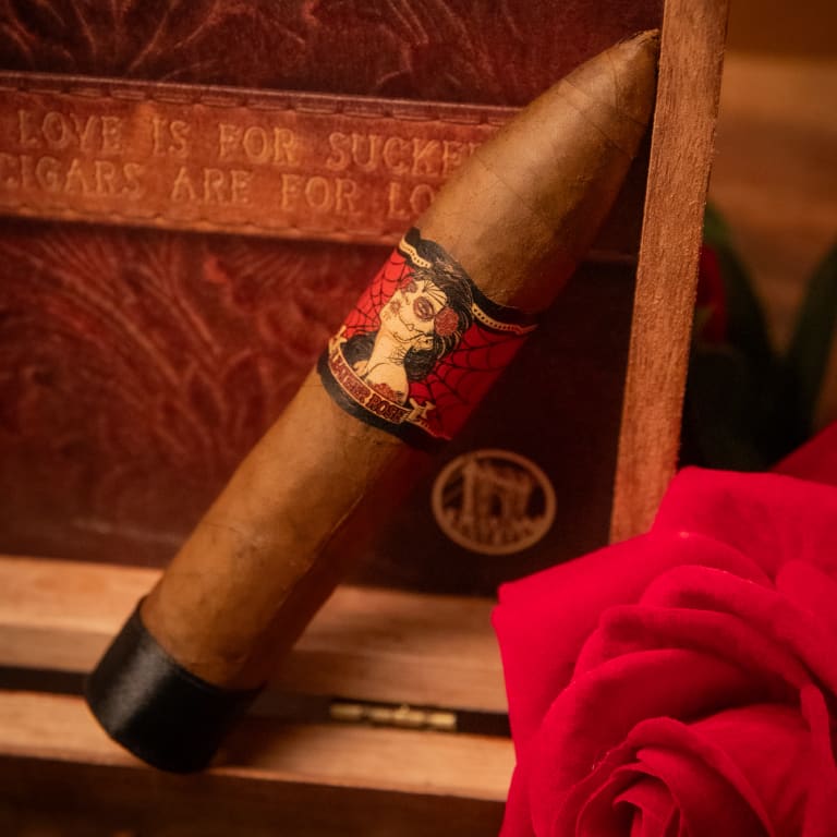 deadwood leather rose cigar laced on a rustic wooden table