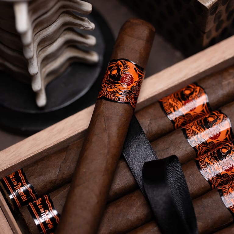 deadwood sweet jane cigar against an open box of cigars