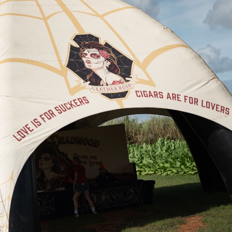 Tent featuring "Leather Rose" branding with the slogan "Love is for suckers, cigars are for lovers.