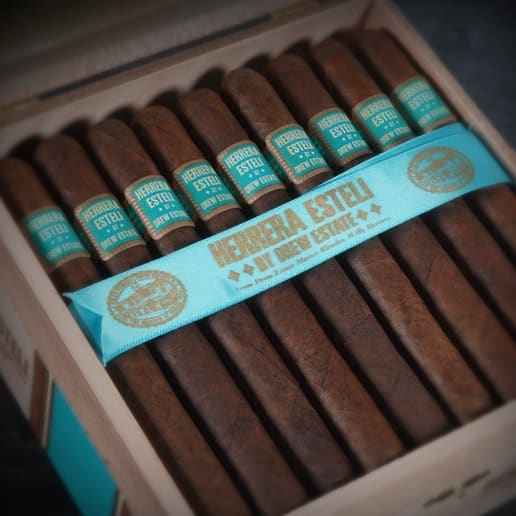 A box of Herrera Esteli Brazil cigars featuring a prominent label on the front, elegantly displayed