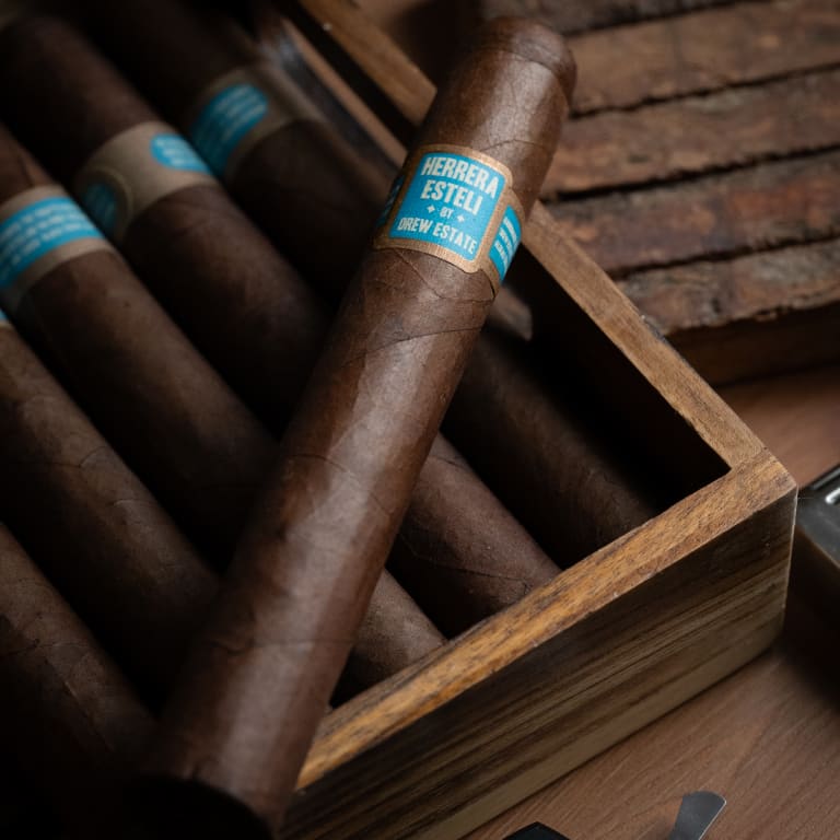 A Herrera Esteli Brazil cigar resting elegantly on a wooden box