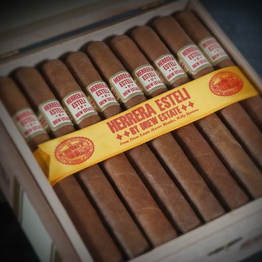 A box of Herrera Esteli Habano cigars featuring a prominent label on the front, elegantly displayed