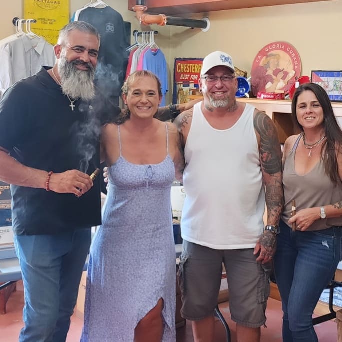 Jonathan Drew posing with customers at in store event