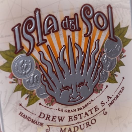 Isla Del Sol Maduro cigar label featuring a bold, radiant sun illustration with metallic accents
