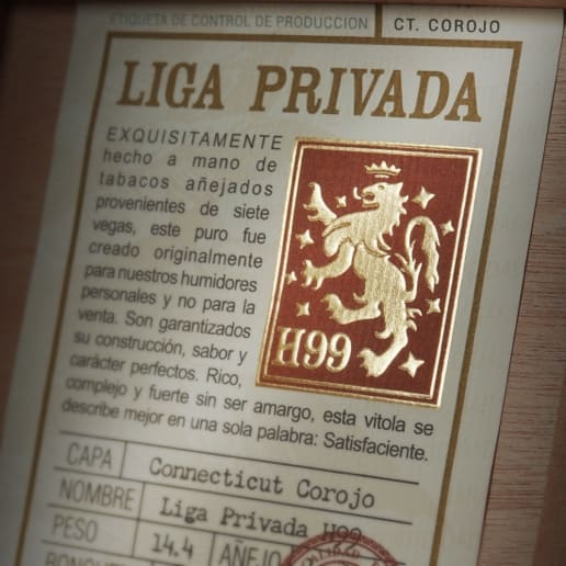 A label on a wooden box featuring a stamp, labeled "Liga Privada H99"