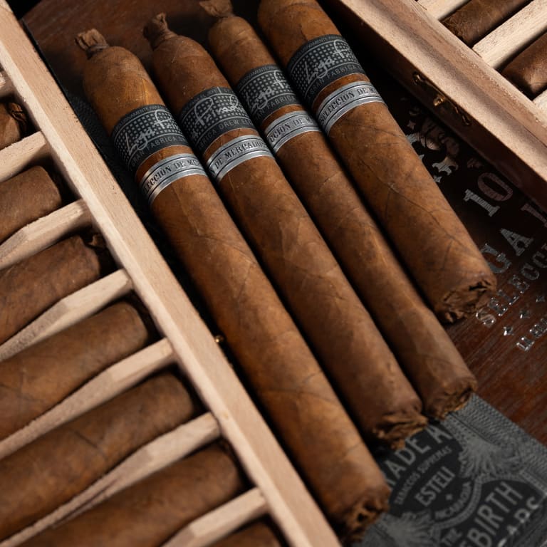 liga privada liga 10 cigars, elegantly arranged with signature black and silver bands