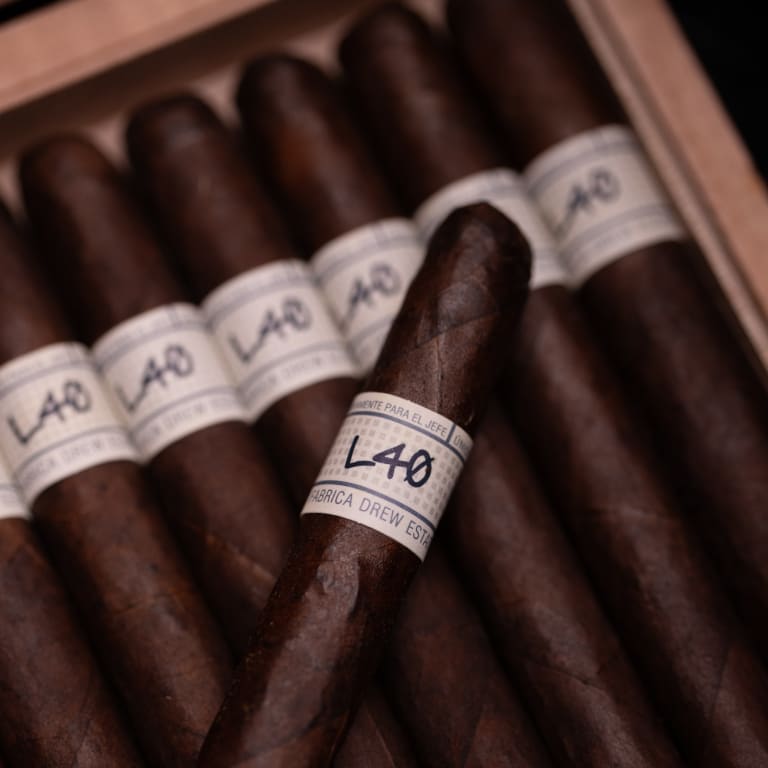 liga privada unico cigar over a box of cigars