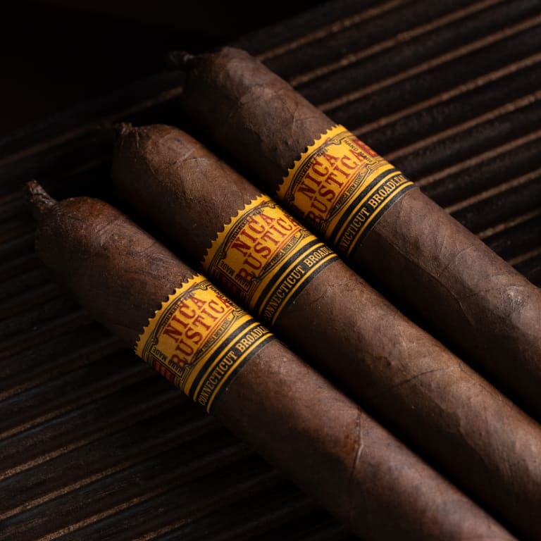 3 nica rustica broadleaf cigars on a wood surface