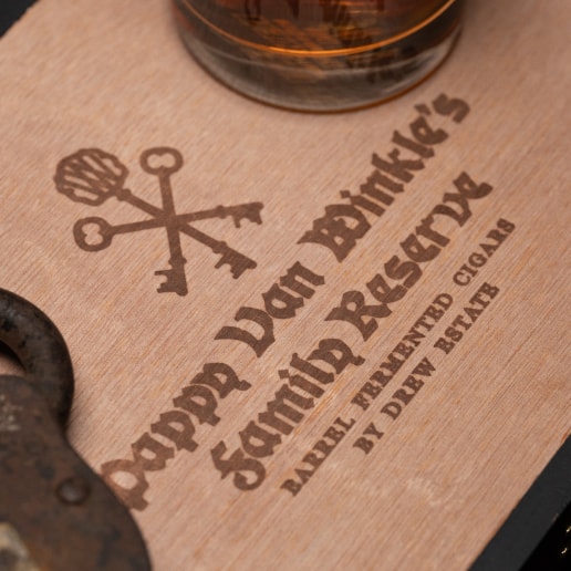 group of Pappy Van Winkle Barrel Fermented cigars on a wood table