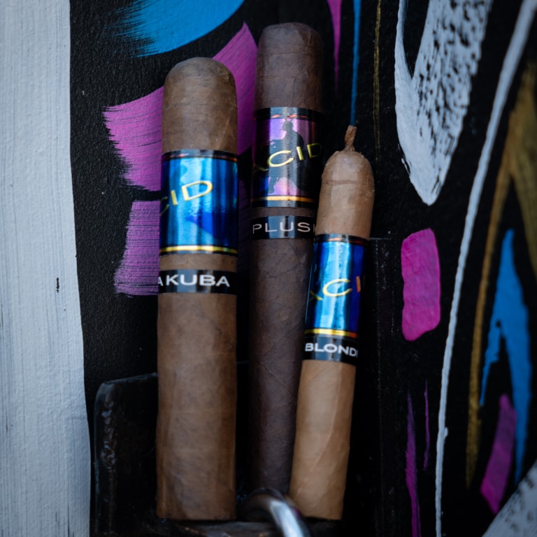 an assorted group of Acid cigars