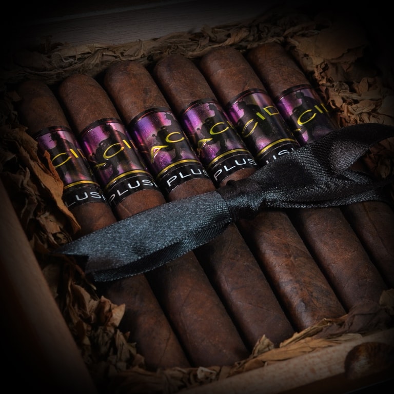 a group of 6 Acid Morado cigars tied with a black silk ribbon