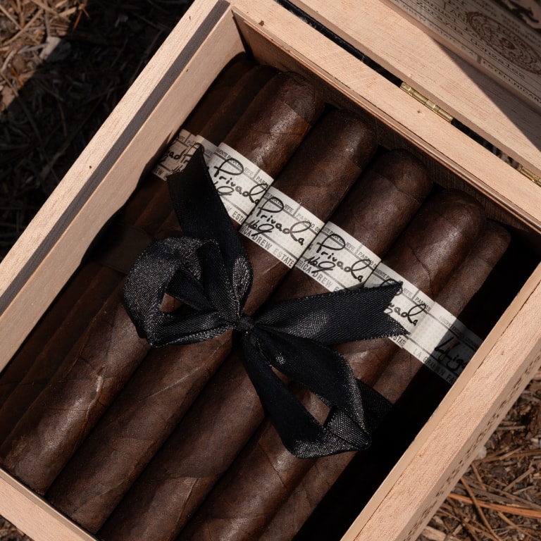 a fine wooden box filled with Liga Privada cigars