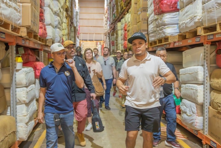 a group of people on a tour of the cigar factory