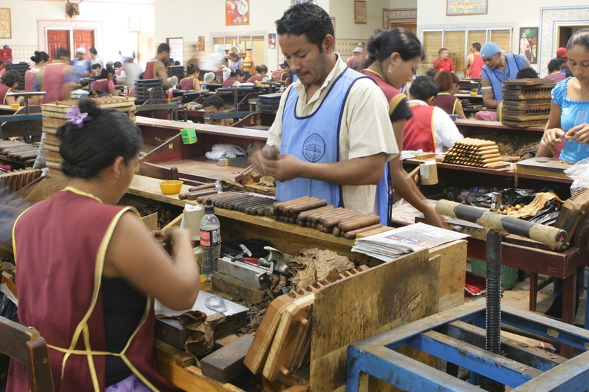 factory people making and packaging cigars