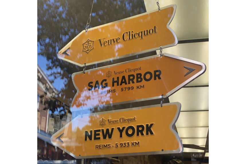 Directional signs indicating the way to New York City, with arrows pointing towards the city.